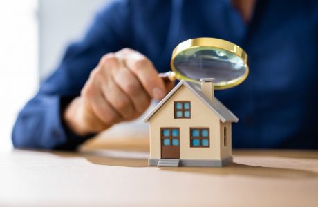 Real Estate House Appraisal By Inspector With Magnifier